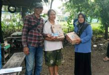 USC Gandeng Frisian Flag Indonesia Bagikan Susu untuk Anak Terdampak Bencana Banjir Sidoarjo